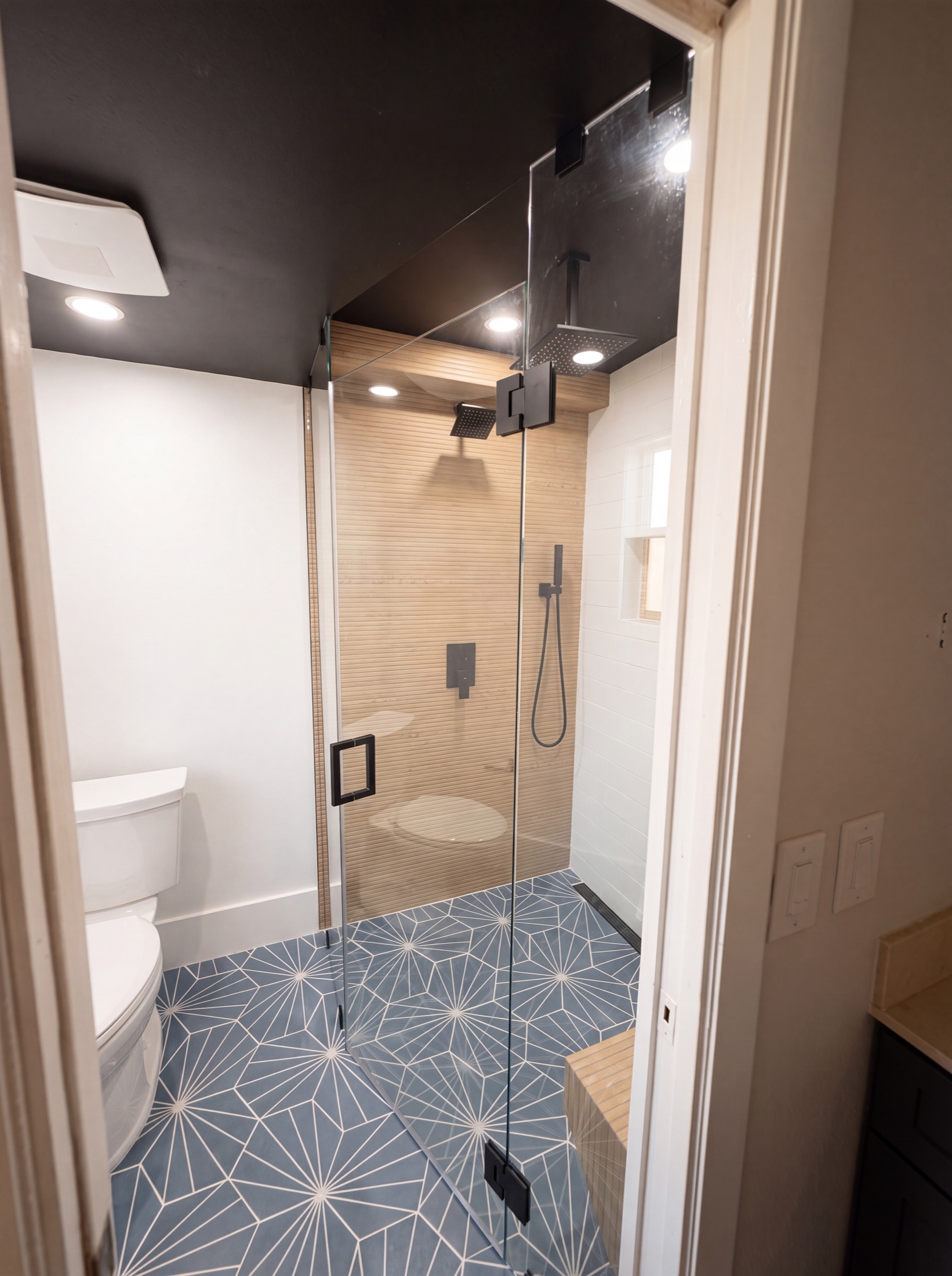 Finished spa bathroom — frameless walk-in shower